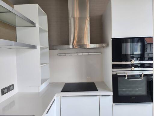 Modern kitchen with stainless steel appliances and white cabinetry