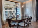 Elegant dining room with natural light and modern chandeliers