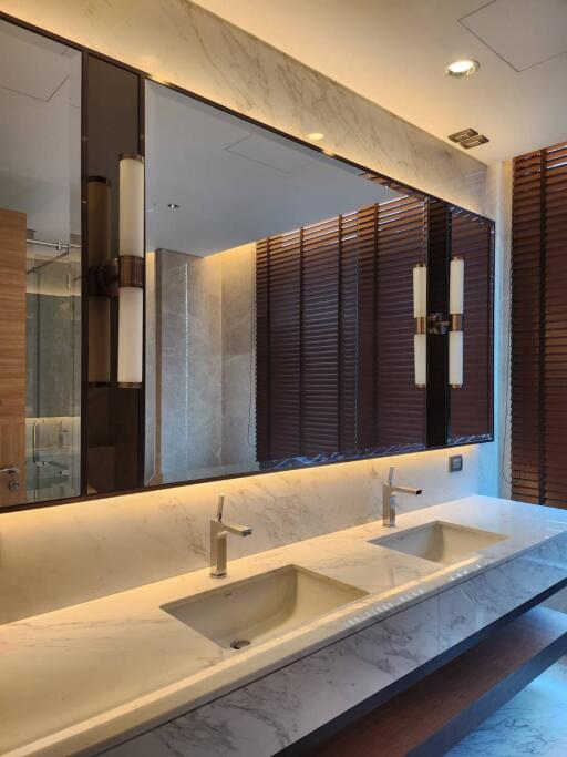 Modern bathroom with dual sinks and marble countertop