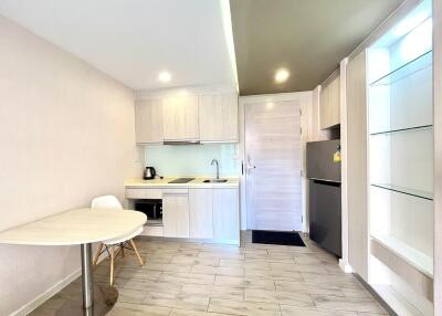 Modern kitchen with white cabinets and integrated appliances