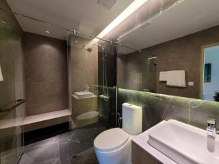 Modern bathroom with shower and marble finishes