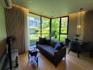 Modern living room with large windows and garden view