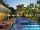 Luxurious outdoor pool area with lounge chairs and lush greenery