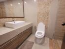 Modern bathroom with beige tiles and contemporary fixtures