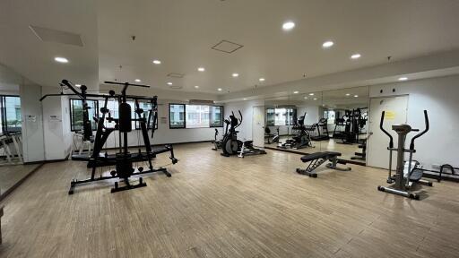 Spacious modern gym with various exercise equipment