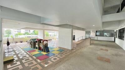 Spacious building lobby with children’s play area