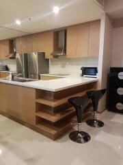 Modern kitchen with stainless steel appliances and breakfast bar