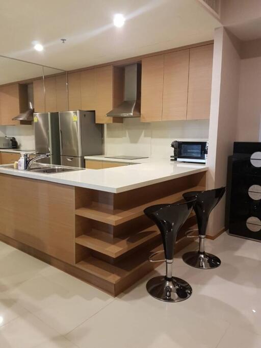 Modern kitchen with stainless steel appliances and breakfast bar