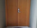 Wooden front door entrance with decorative rug