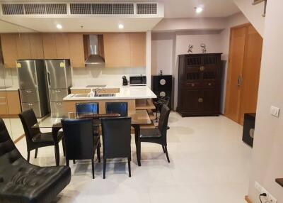 Modern kitchen with dining area and stainless steel appliances