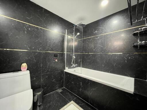 Modern bathroom interior with marble tiles and shower