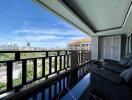 Spacious balcony with city view and comfortable seating