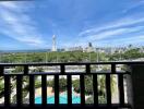 Balcony view overlooking city skyline and swimming pool