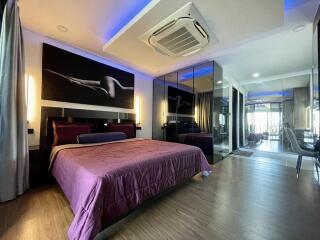 Modern bedroom with king-sized bed and sophisticated interior design