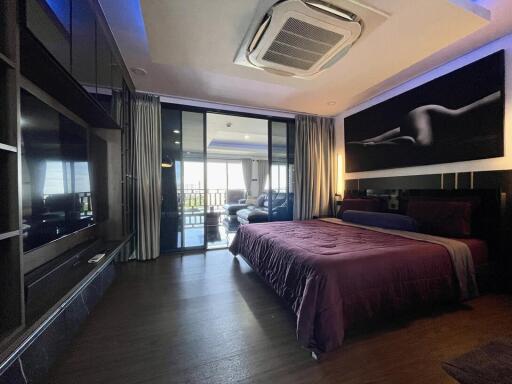 Spacious modern bedroom with a large bed and a spectacular view