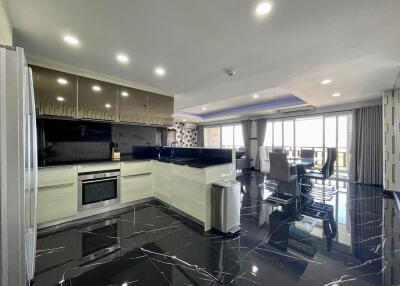 Modern kitchen with open plan leading to dining area