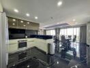 Modern kitchen with open plan leading to dining area