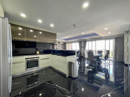 Modern kitchen with open plan leading to dining area