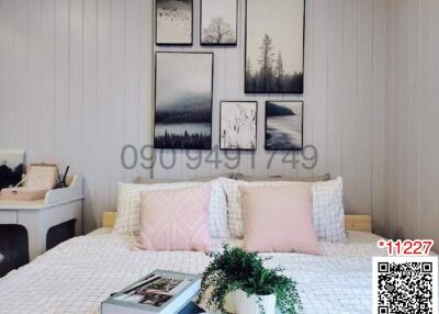 Cozy bedroom with well-decorated interior and wall art