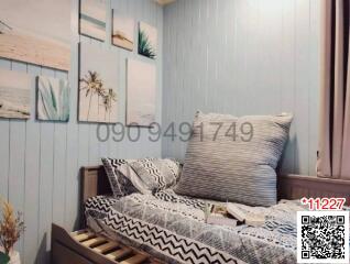 Cozy bedroom with patterned bedding and blue wall panels