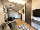 Modern living room with kitchen in the background