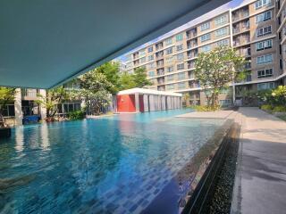 Swimming pool with modern residential buildings in the background