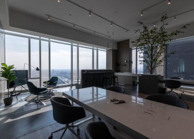 Modern high-rise apartment interior with floor-to-ceiling windows and city view