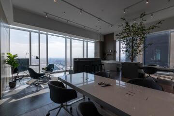 Modern high-rise apartment interior with floor-to-ceiling windows and city view