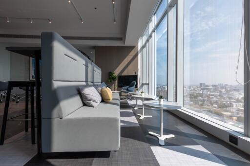 Modern living space with expansive windows and city view