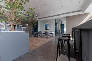 Modern open-plan living space with kitchen island and sitting area