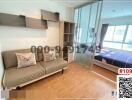 Compact bedroom with a sofa and bed, fitted shelves, hardwood flooring, and balcony access