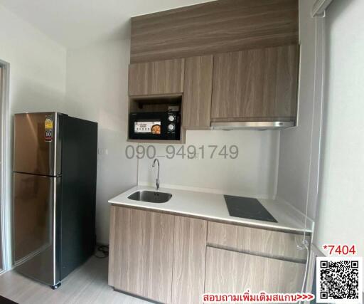 Modern kitchen with stainless steel appliances and wooden cabinets