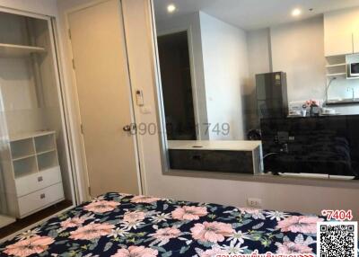 Compact bedroom with built-in wardrobe and kitchenette