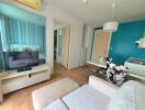 Bright living room with modern furniture and turquoise accent wall