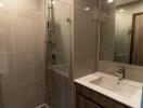 Modern bathroom with walk-in shower and vanity