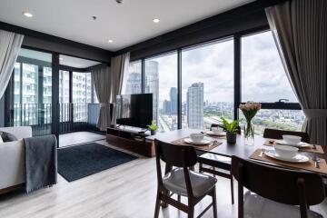 Spacious living room with modern furniture and large windows