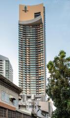 High-rise residential tower, modern architecture, urban background