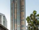 High-rise residential tower, modern architecture, urban background