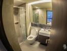 Modern bathroom interior with glass shower and marble accents