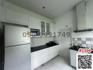 Modern kitchen with appliances and white cabinetry