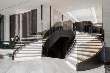 Elegant grand staircase in a modern lobby interior