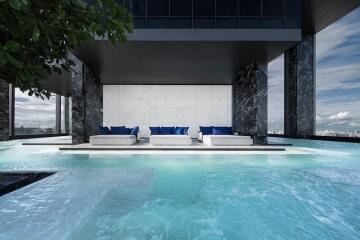 Luxurious rooftop infinity pool with cityscape view and lounge area