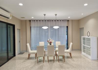 Modern dining room with large table and comfortable chairs