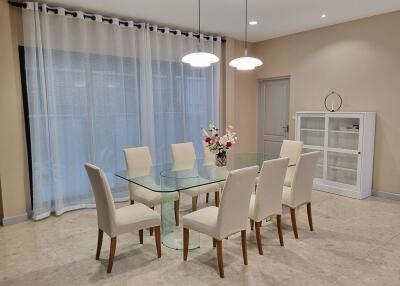Elegant dining room with glass table and chairs