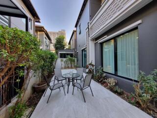 Modern patio area with outdoor seating and garden