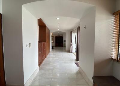 Spacious hallway leading to the main living areas with natural light