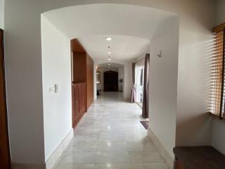 Spacious hallway leading to the main living areas with natural light