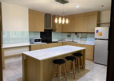 Modern kitchen with central island and bar stools