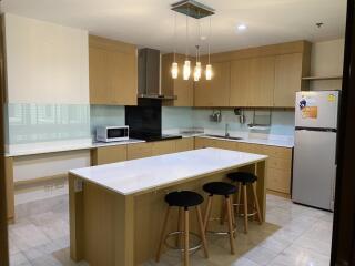 Modern kitchen with central island and bar stools