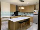 Modern kitchen with central island and bar stools